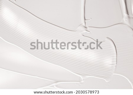 Skincare cosmetics and cream product texture or antibacterial liquid soap for hand washing for virus protection and hygiene, holiday flatlay design or abstract wall art and paint strokes. Royalty-Free Stock Photo #2030578973