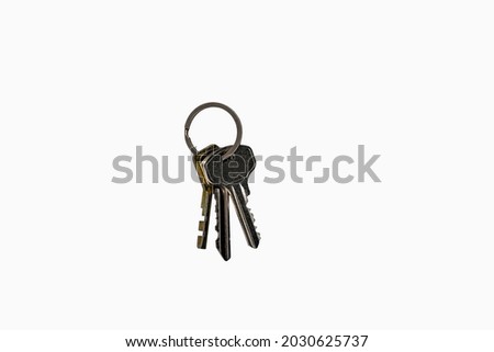 Directly above photo, bunch of keys, three keys in a bunch isolated on white background