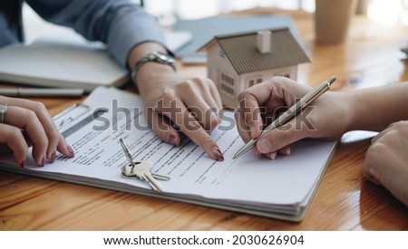 legal consultants, notary or justice lawyer discussing contract document on desk with client customer in courtroom office, business, justice law, insurance, legal service, buy and sell house concept Royalty-Free Stock Photo #2030626904