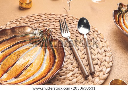 Beautiful table setting for Thanksgiving Day celebration on color background