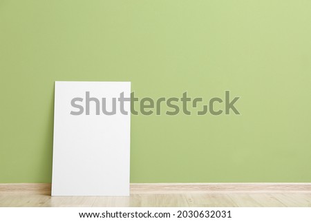 Blank poster near color wall