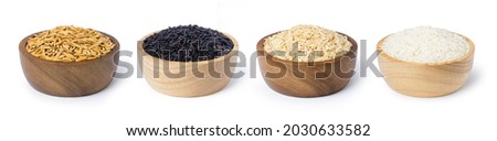 Various type and color of rice ; paddy rice, riceberry, brown coarse rice and white thai jasmine rice in wooden bowl isolated on white background. Healthy diet concept. Royalty-Free Stock Photo #2030633582