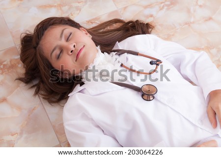 Female doctor very tired from her work.