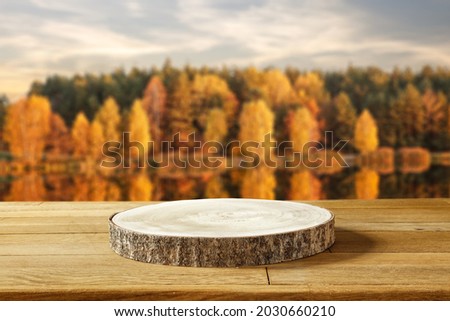 Wooden desk of free space for your decoration and autumn landscape. 