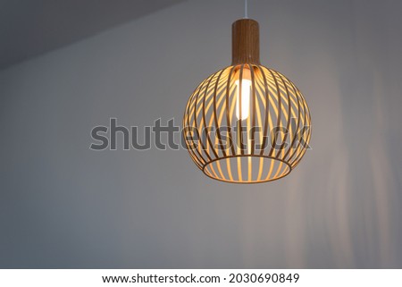 Modern wooden ceiling lamp light bulbs with interior for office building or home and living decoration style contemporary. Concept nature applied.
