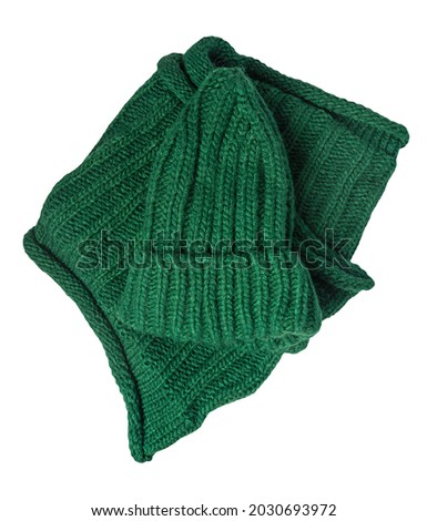 green knitted hats and scarf isolated on a white background. winter accessories
