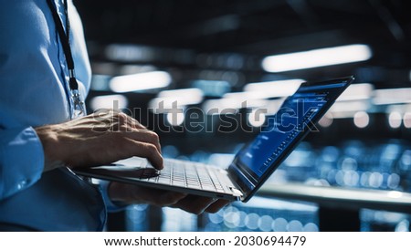 Data Center Programmer Using Digital Laptop Computer, Maintenance IT Specialist. Cloud Computing Server Farm System Administrator Working on Cyber Security for Iaas, saas, paas. Closeup Focus on Hands Royalty-Free Stock Photo #2030694479