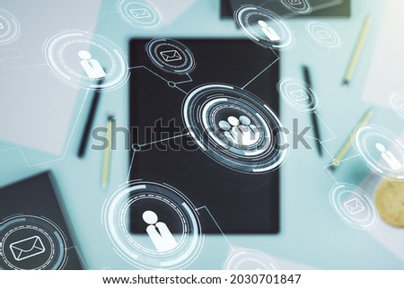 Double exposure of social network icons concept and digital tablet on background, top view. Marketing and promotion concept