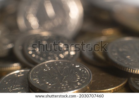Blurred image of polish coins. Partial focus on Eagle. Ideal for financial background