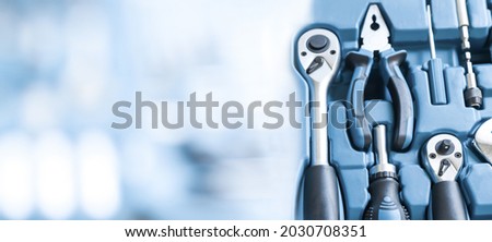 Banner with home and auto repair tools with copy space. Background with construction tools close-up.