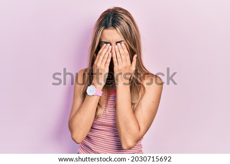 Beautiful hispanic woman wearing casual summer t shirt rubbing eyes for fatigue and headache, sleepy and tired expression. vision problem 
