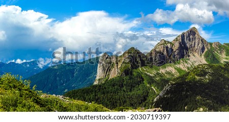 Mountainside snow on panoramic landscape Royalty-Free Stock Photo #2030719397