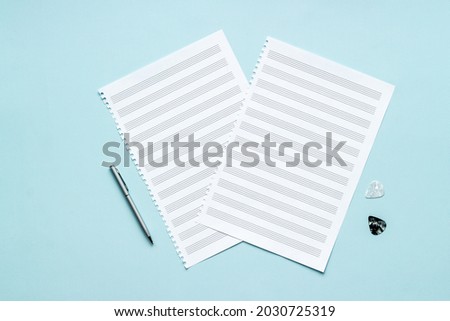 Empty music sheets for writing notes, top view. Compose music concept