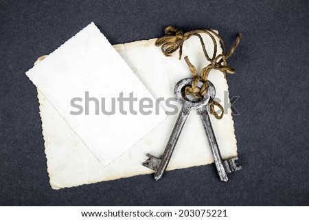  rusty keys and empty photograph as a blackout metaphor