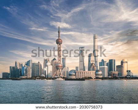 Shanghai famous skyline from the water and beautiful sky
