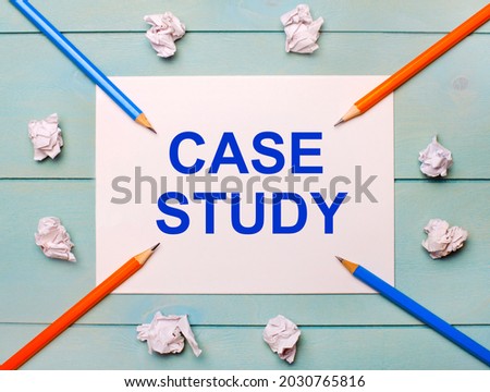 On a blue background - black and orange pencils, white crumpled sheets of paper and a white sheet of paper with the text CASE STUDY