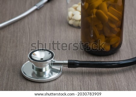 Stethoscope and tablets on a table