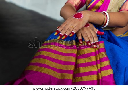 Close up of an Indian woman hand design with mehendi for a wedding or another ceremony. Mehndi hands closeup concept. Selective focus.