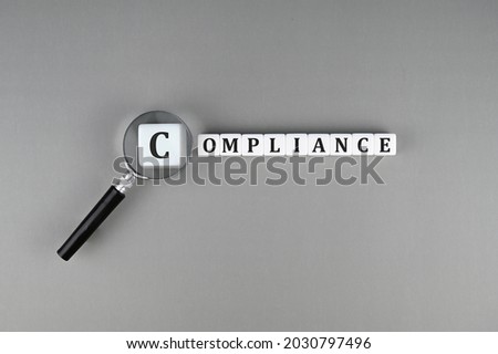 Compliance text on white cubes Royalty-Free Stock Photo #2030797496