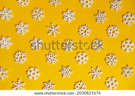 New Year's pattern of figures of Christmas trees and snowflakes on a yellow and red background happy New Year and Christmas