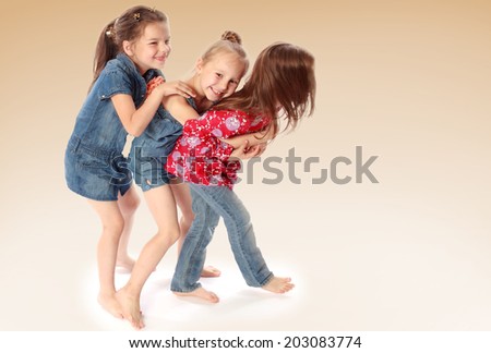 three friends playing and having fun.family joy, happy family,happiness concept,happy childhood,carefree childhood,active lifestyle