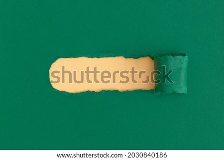Green torn paper with space for text with yellow background