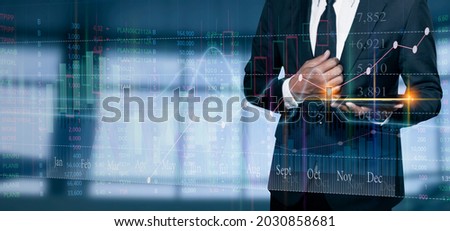 Double exposure of businessman using digital tablet with stock market graph or forex trading chart,  Business digital and financial concept.