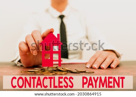 Conceptual caption Contactless Payment. Conceptual photo use near field communication for making secure payments New home installments and investments plans represeneted by lady