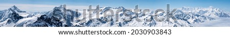 Switzerland, Panoramic view on Snow Alps and Blue Sky around Titlis mountain Royalty-Free Stock Photo #2030903843