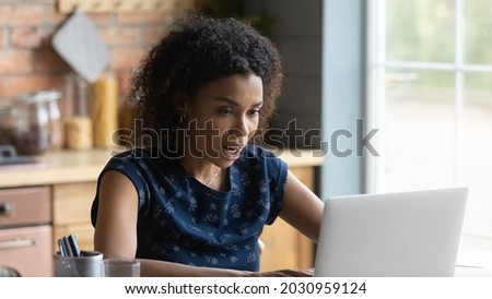 Shocked frustrated millennial African girl surprised with laptop problems, getting email letter with bad news, becoming scam victim, looking at screen with online app mistake, software error. Banner