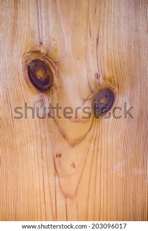 wooden planks texture with pattern of knots like the face