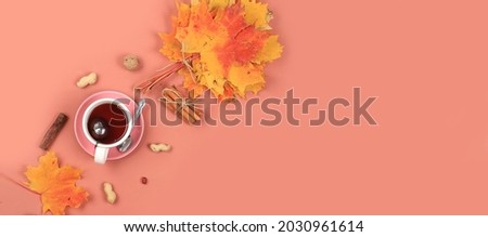 Autumn composition flat lay, seasonal background with maple leaves, cinnamon and tea. Happy Thanksgiving concept, greeting card, banner for screen, top view, selective focus