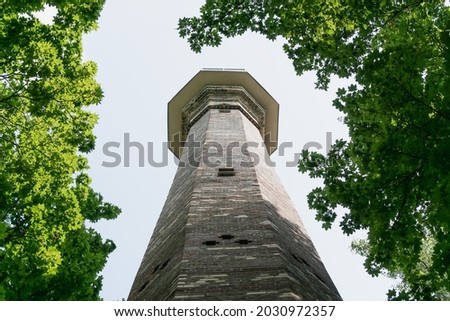 High ancient brick chimney with panoramic view in the park