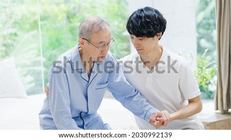 Caregiver caring for a senior man