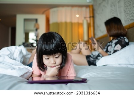 chinese child addicted phone, asian girl playing smartphone, kid watching cartoon
