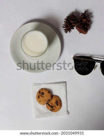 Chocolate biscuits with chocolate chip topping as snacks in the morning, are very popular among children to old age. Biscuits and milk are the perfect combination of food and drink. Biscuit mockup.