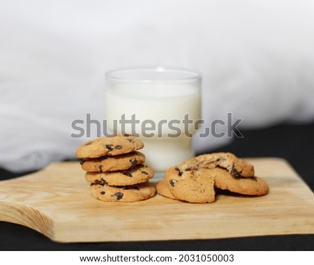 Chocolate biscuits with chocolate chip topping as snacks in the morning, are very popular among children to old age. Biscuits and milk are the perfect combination of food and drink. Biscuit mockup.