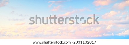 Clear blue sky, red, pink, golden cirrus and cumulus clouds after storm. Dramatic sunset cloudscape. Concept art, meteorology, heaven, hope, peace, graphic resources, picturesque panoramic scenery