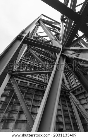 Metal structure that forms part of a construction of a bridge in Bilbao, Spain. Black and white photography