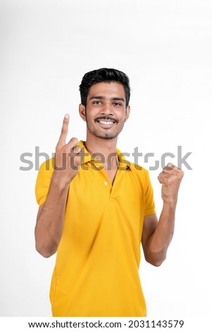 Young indian man showing expression with hand on white background