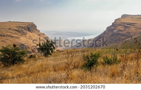 View of Mount Arbel(on right) and Mount Nitai (on left) as seen from the road to Arbel National Park, Arbel Nature Reserve, eastern Galilee, Northern Israel, Israel  Royalty-Free Stock Photo #2031202670
