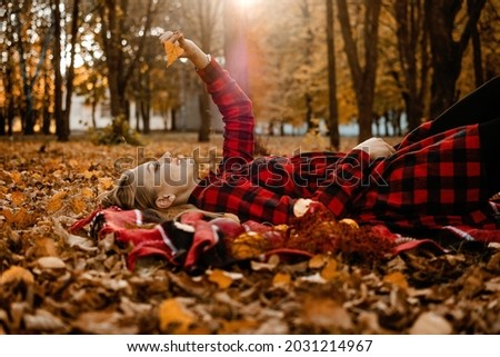 Fall picnic ideas, autumn day off, solo picnic, Self Date, Things to Do by Yourself. Alone young woman enjoying life in the autumn park