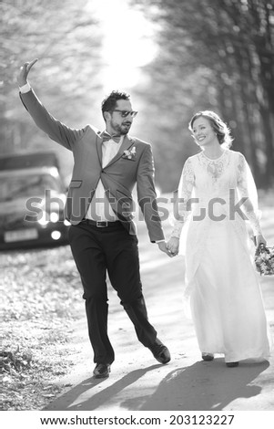 Newlywed caucasian couple together. Wedding day in black and white.