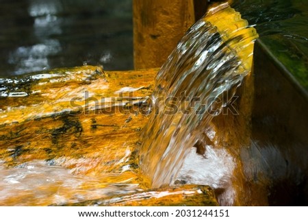 Mineral spring with rusty colored chalybeate water