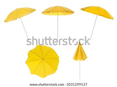 Set with yellow beach umbrellas on white background  Royalty-Free Stock Photo #2031299537