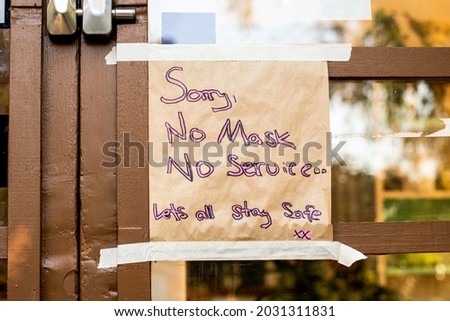 No mask no service. Handwritten sign on a cafe door in Australia during delta outbreak lockdown restriction. No mask no enrty