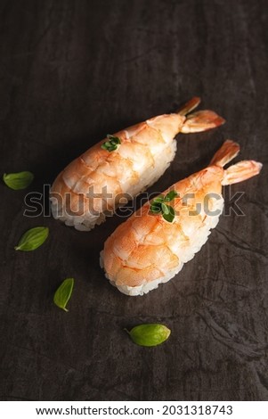 Shrimp sushi on black background Royalty-Free Stock Photo #2031318743