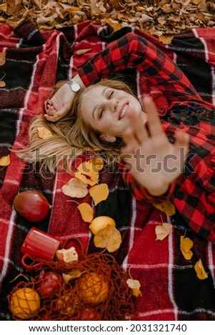 Fall picnic ideas, autumn day off, solo picnic, Self Date, Things to Do by Yourself. Alone young woman enjoying life in the autumn park