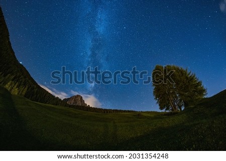 The magnificent night view of the Milky Way over the Sasso Lungo in Selva di Val Gardena