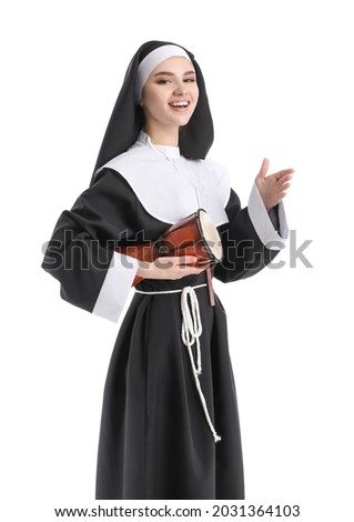 Young nun with drum on white background